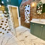 Luxury_Wetroom_Installtion_with_Puke_green_vanity_rustic_bathroom_brick_wall