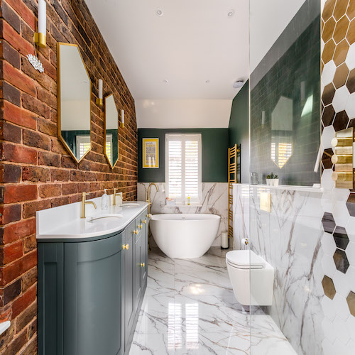 Large_marble_tiled_ensuite_with _large_freestading_Lusso_bath_green_painted_walls_and_large_double_vanity_unit